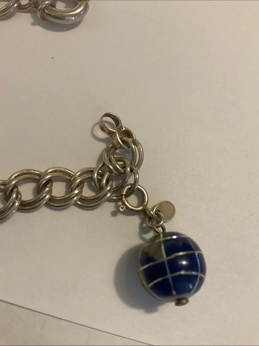 Sterling silver charm bracelet with world charm